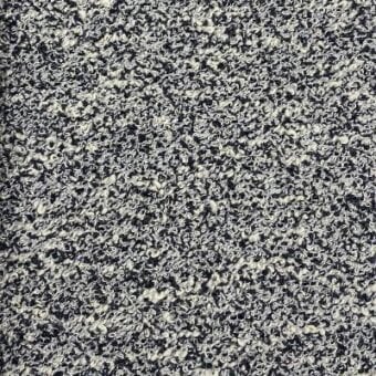 Bouclé fabric texture sample, dark navy and off-white mottled weave, exhibiting a nubby looped surface with integrated fabric identification text.
